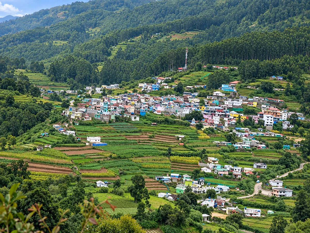 Vattavada village surrounded by terraced farms and forested hills