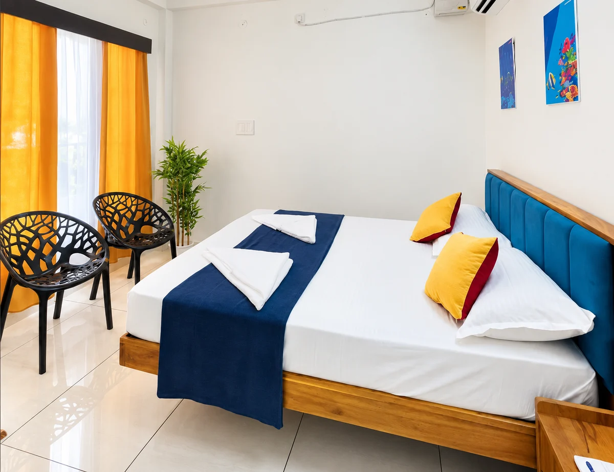 Supplied Island Comfort room photo, enhanced for lighting and clarity, with a blue headboard, white bedding and yellow curtains